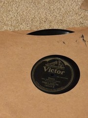Lot of Nine (9) 78 rpm records in beautiful condition, in a book see list